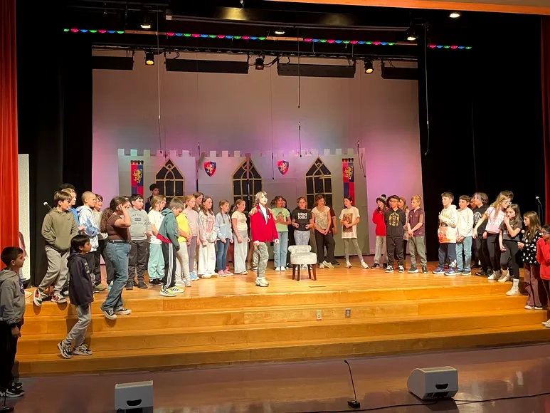 Weston band performing under stage lights
